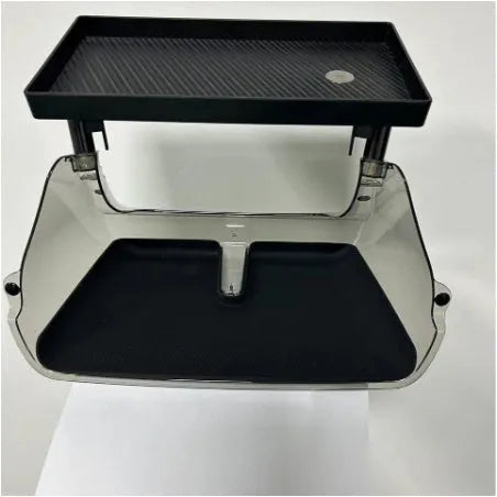Black ABS plastic storage box installed under the screen of a Tesla Model Y centre console.