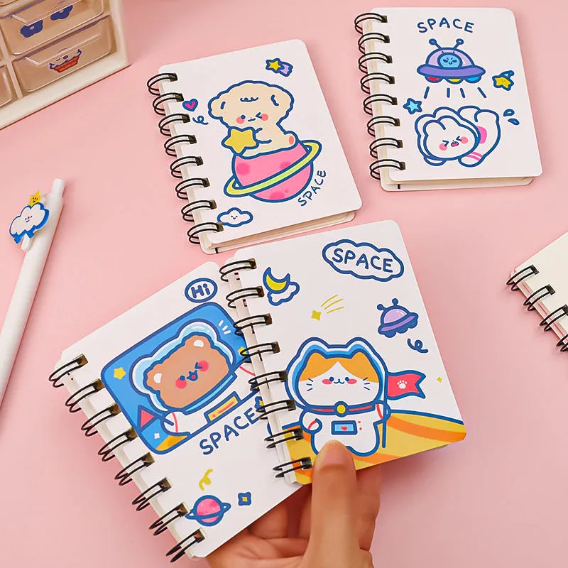 Astronaut themed pocket notebook showing 10.5 x 8 cm dimensions with space decoration