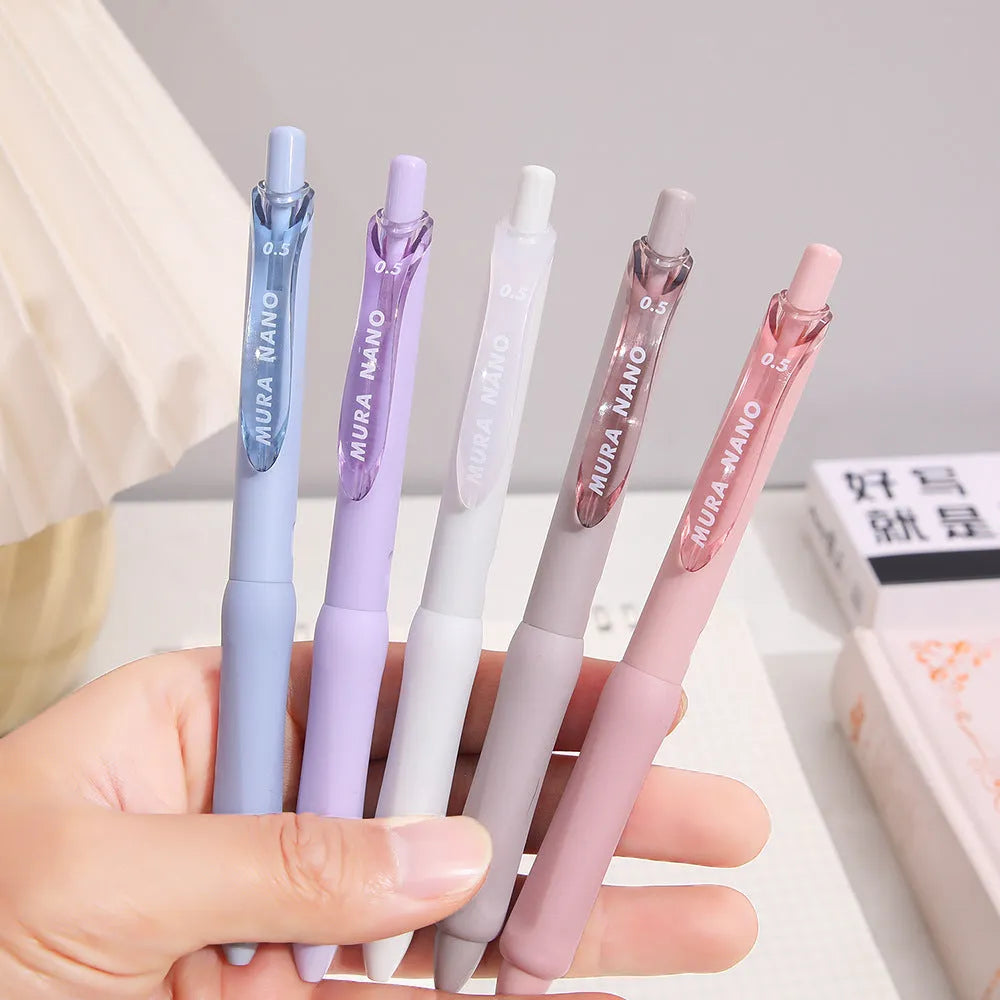 Macaron Colour press gel pen with 0.5mm tip in smoked white, brown, and pink options.