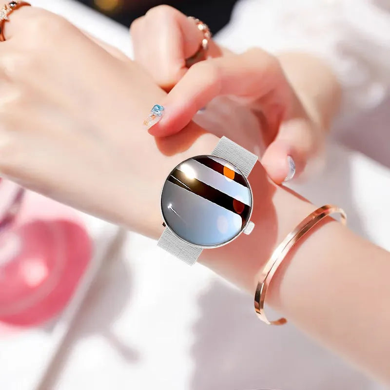 Women's smart watch with circular aluminium alloy case and metal strap showing colour touch screen