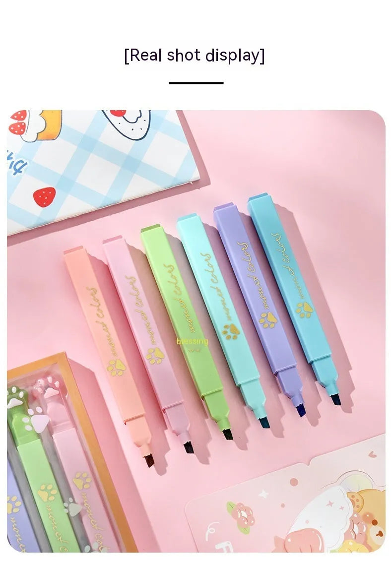 Box of six Cat's Paw fluorescent marking pens with oblique nibs, shown in assorted colours.