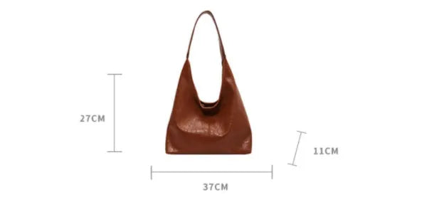 Casual soft PU leather shoulder bag in street trend style with large capacity and sandwich pocket.