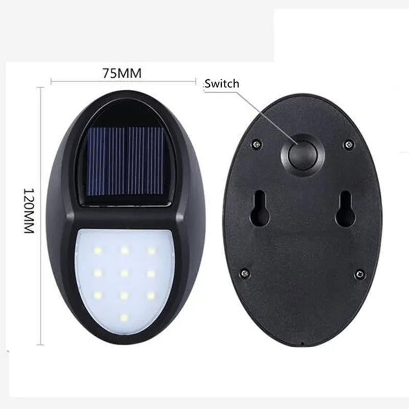 Compact black rectangular solar-powered LED wall light mounted on an outdoor wall.