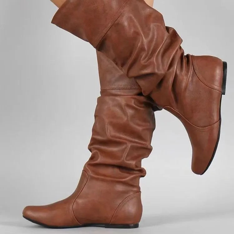 Women's black flat-heel slip-on long boots with a round toe and high cylinder shaft.