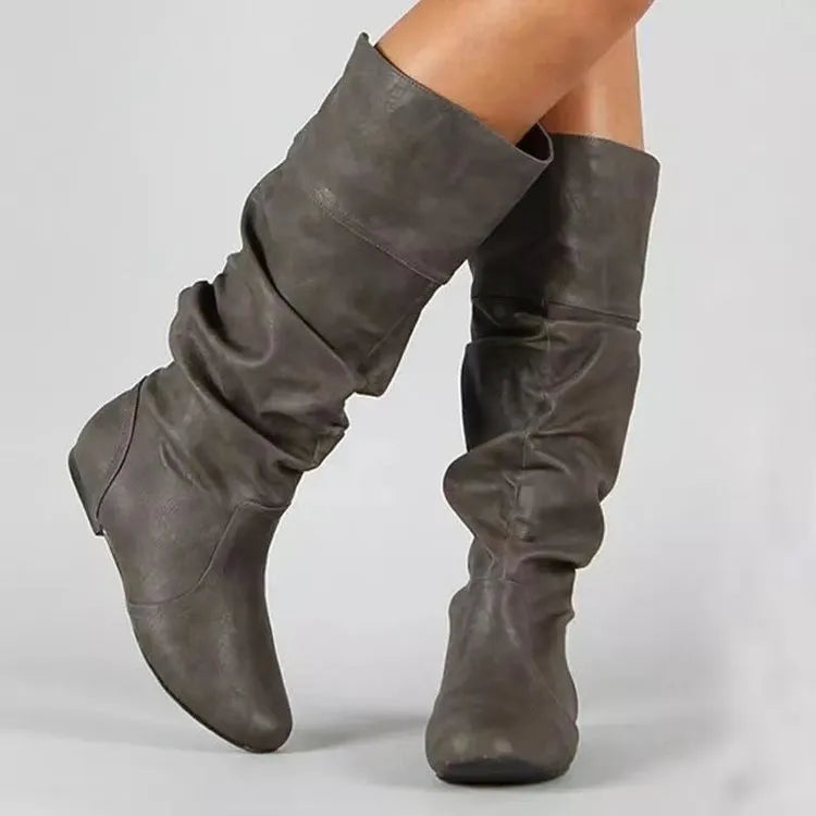 Women's black flat-heel slip-on long boots with a round toe and high cylinder shaft.