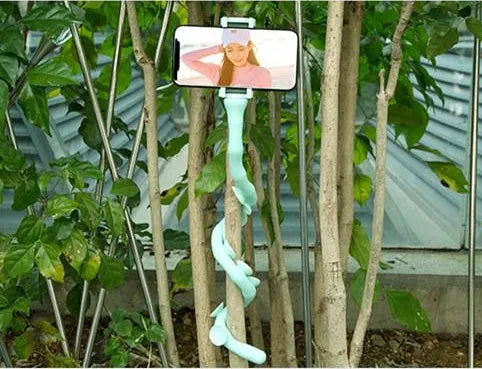 Flexible rubber phone holder with suction cup base showing 360 degree rotation capability