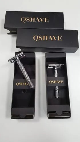 Chrome-plated double edged safety razor with textured handle and storage box.