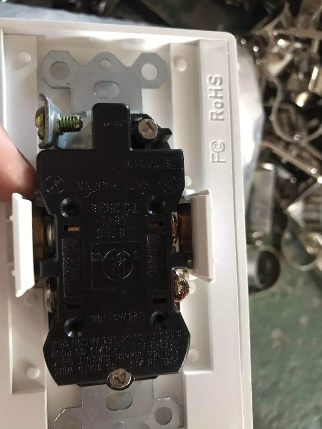 White socket induction LED night light plugged into a wall outlet.