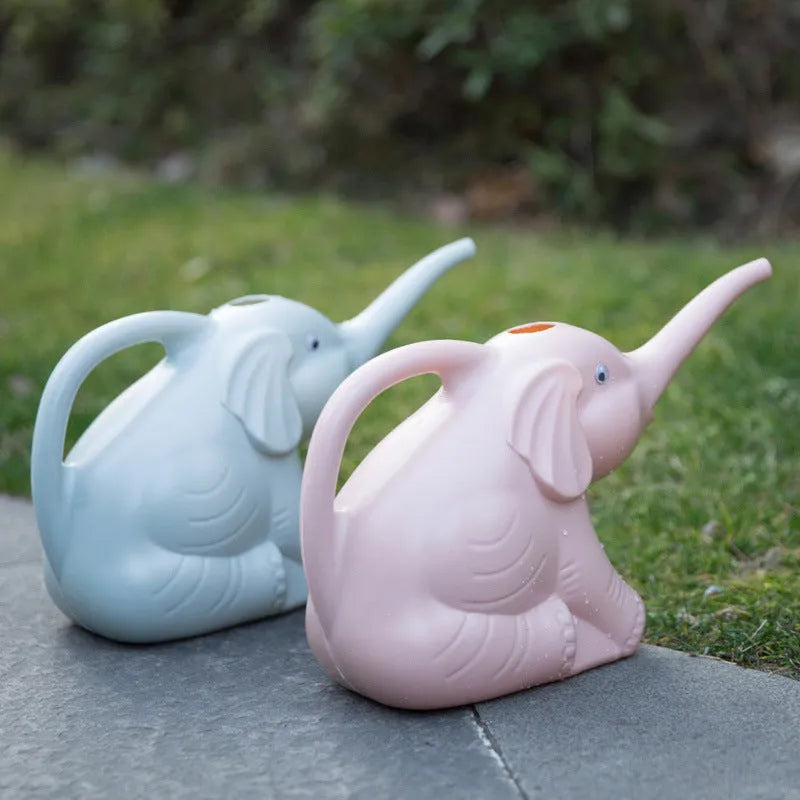 Pink elephant-shaped children's watering can with long nozzle and baby bottle handle.