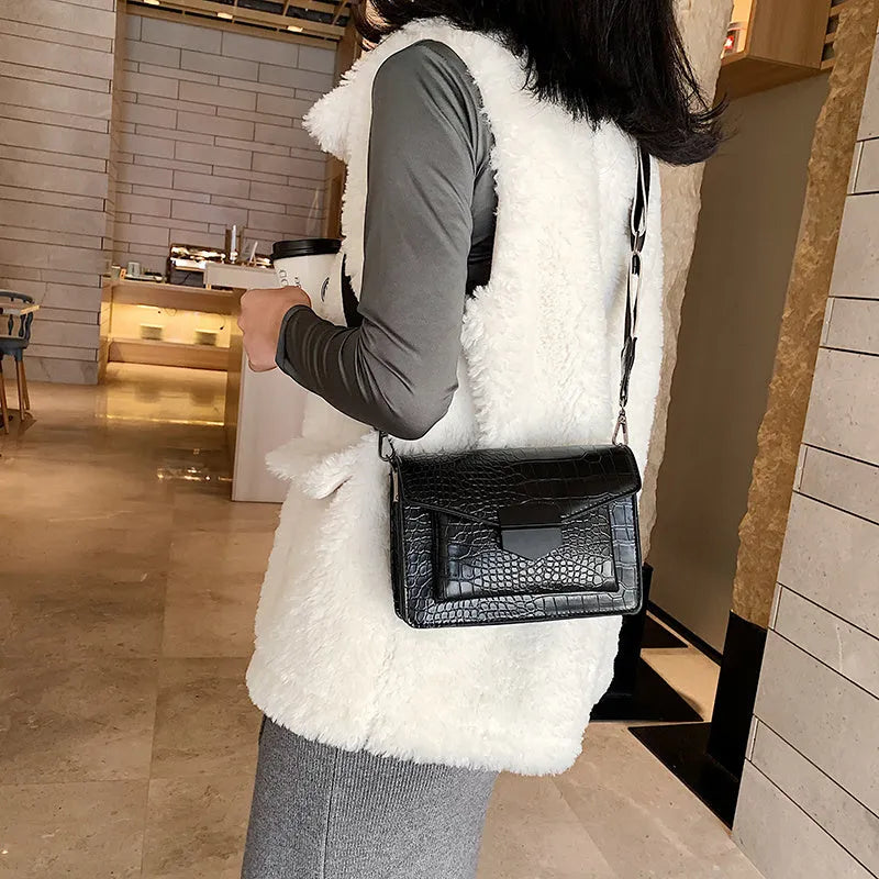 Vintage style crossbody bag in PU material showing 20cm width with four colour options