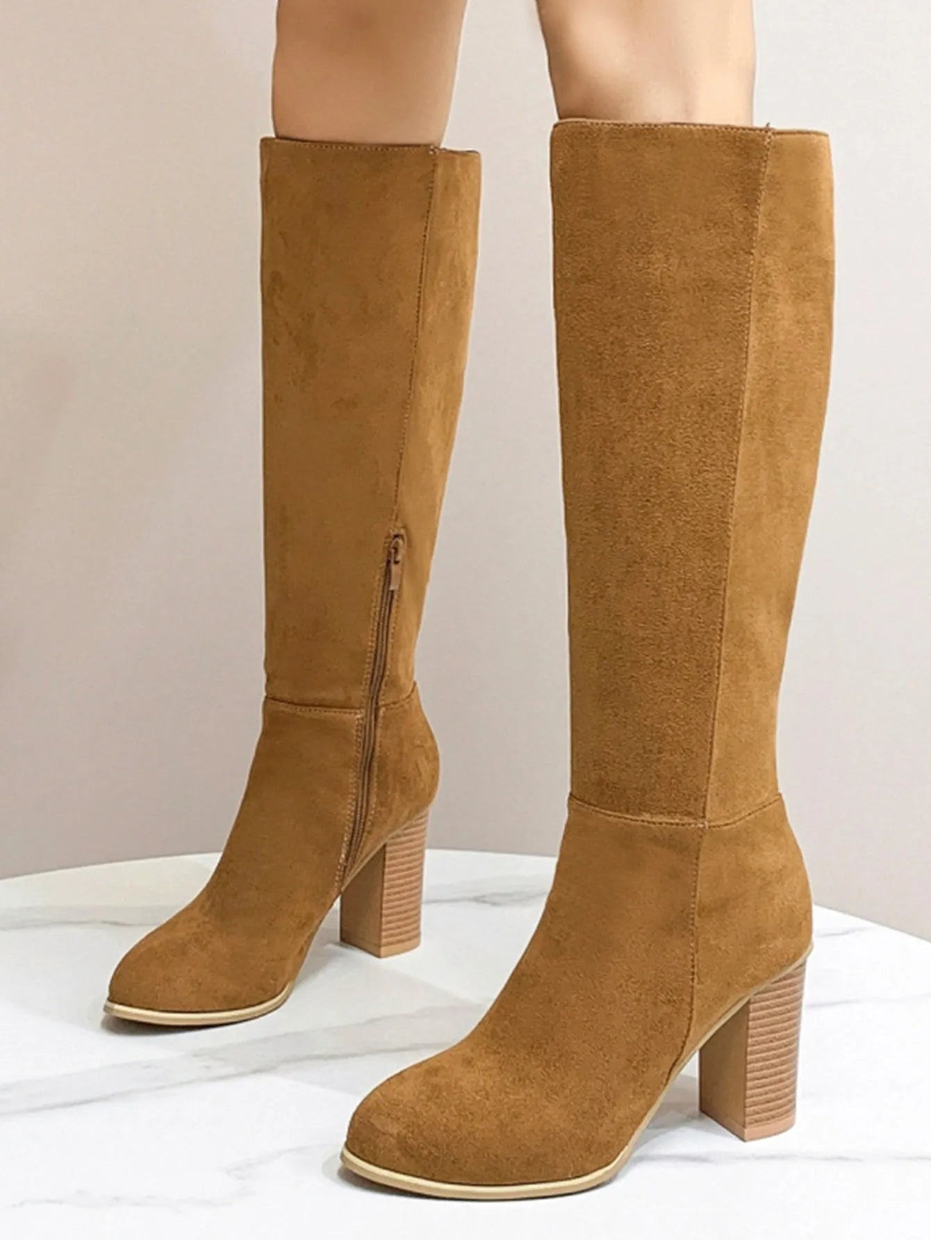 Women's black square toe high heel casual boot made of artificial PU.