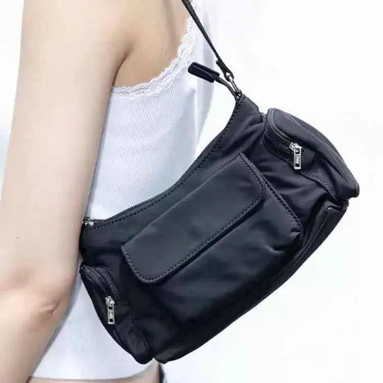Black lightweight women's shoulder bag with double pockets and side line detail