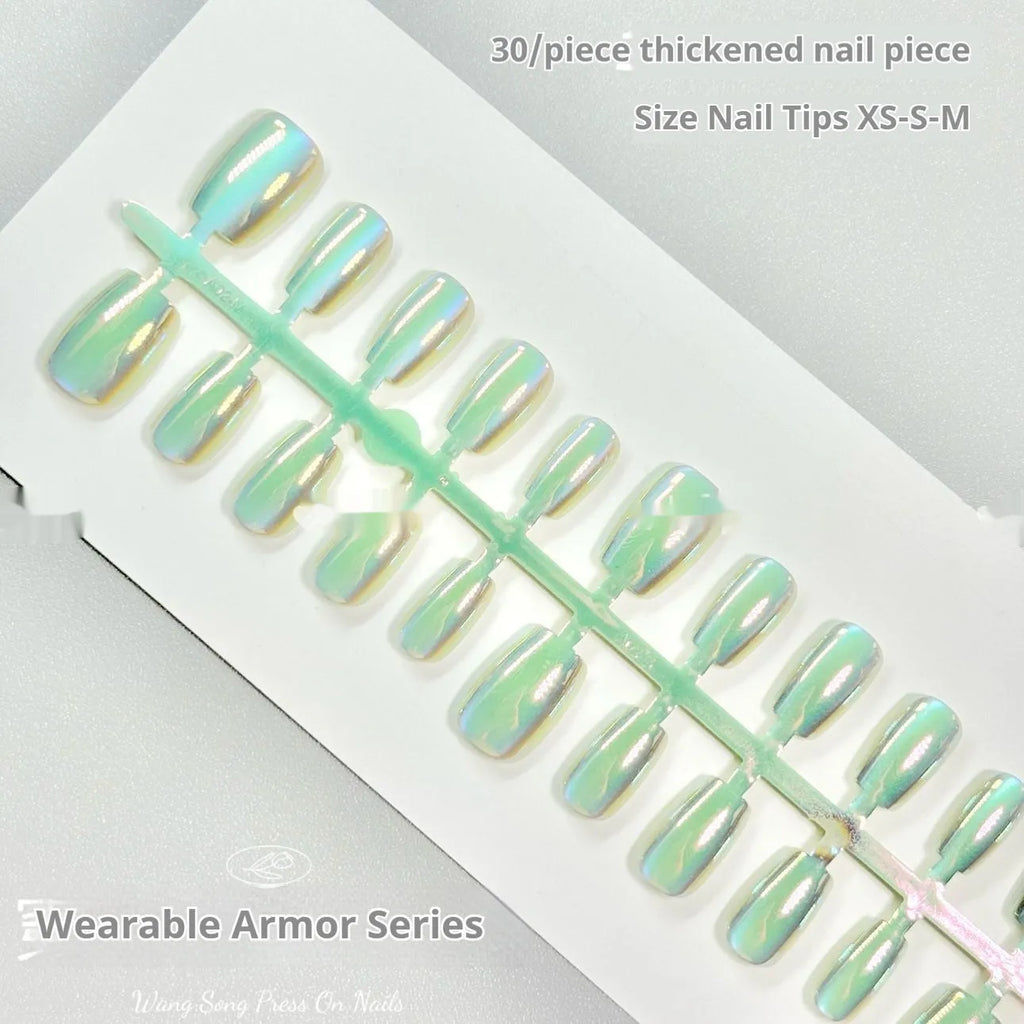 Electroplated cat's eye false nails with aurora glitter on short ladder shapes in sizes XS, S, and M.
