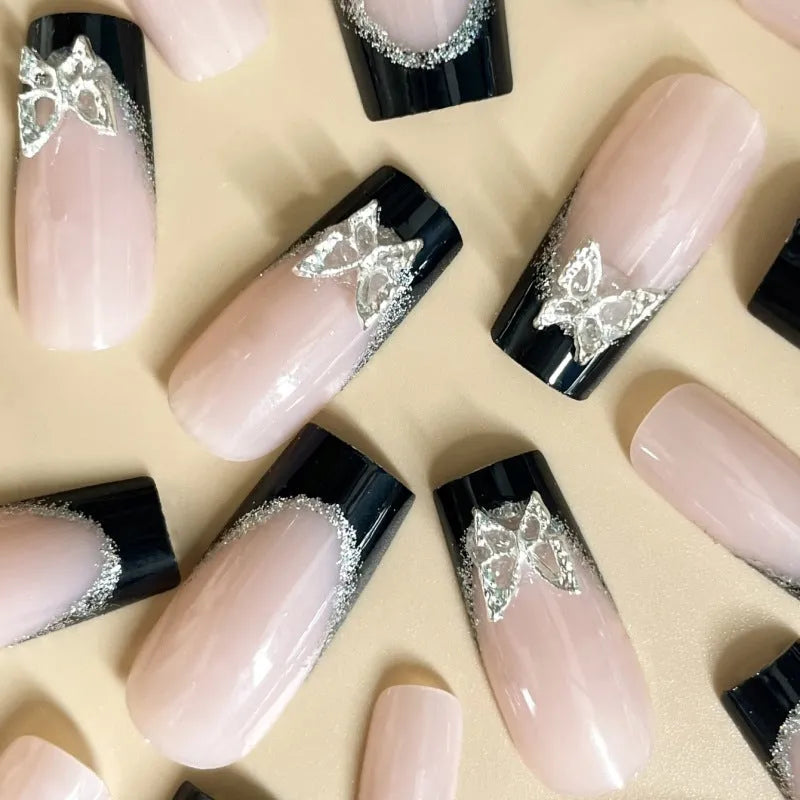 French style artificial nails with glittering butterfly pattern in medium length wearable design