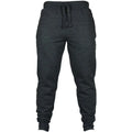 Man wearing solid colour cotton fleece drawstring trousers with a loose fit.