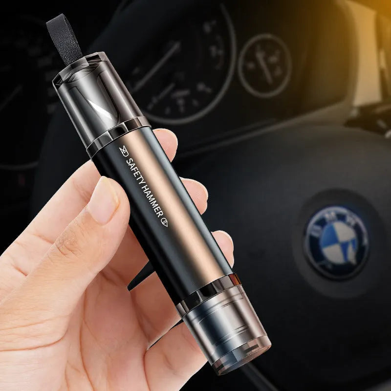 Black and red aluminium alloy car safety hammer with tungsten steel window breaker tip and hidden seat belt cutter.