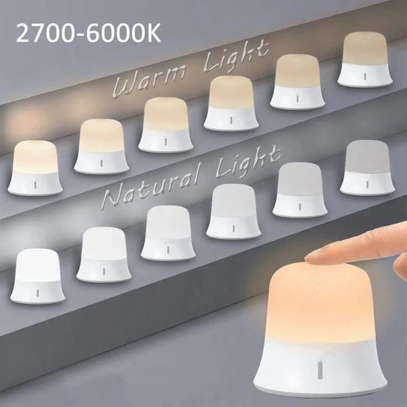 White bedside touch control night light with motion sensor, shown with warm white glow.
