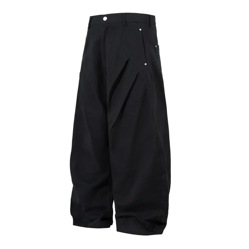 Men's black cotton trousers with pleated machete detailing and loose-fitting wide-leg silhouette
