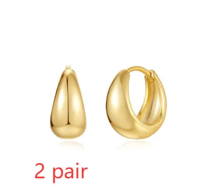 Brass diamond geometric earclip earrings with round elements and golden electroplated finish