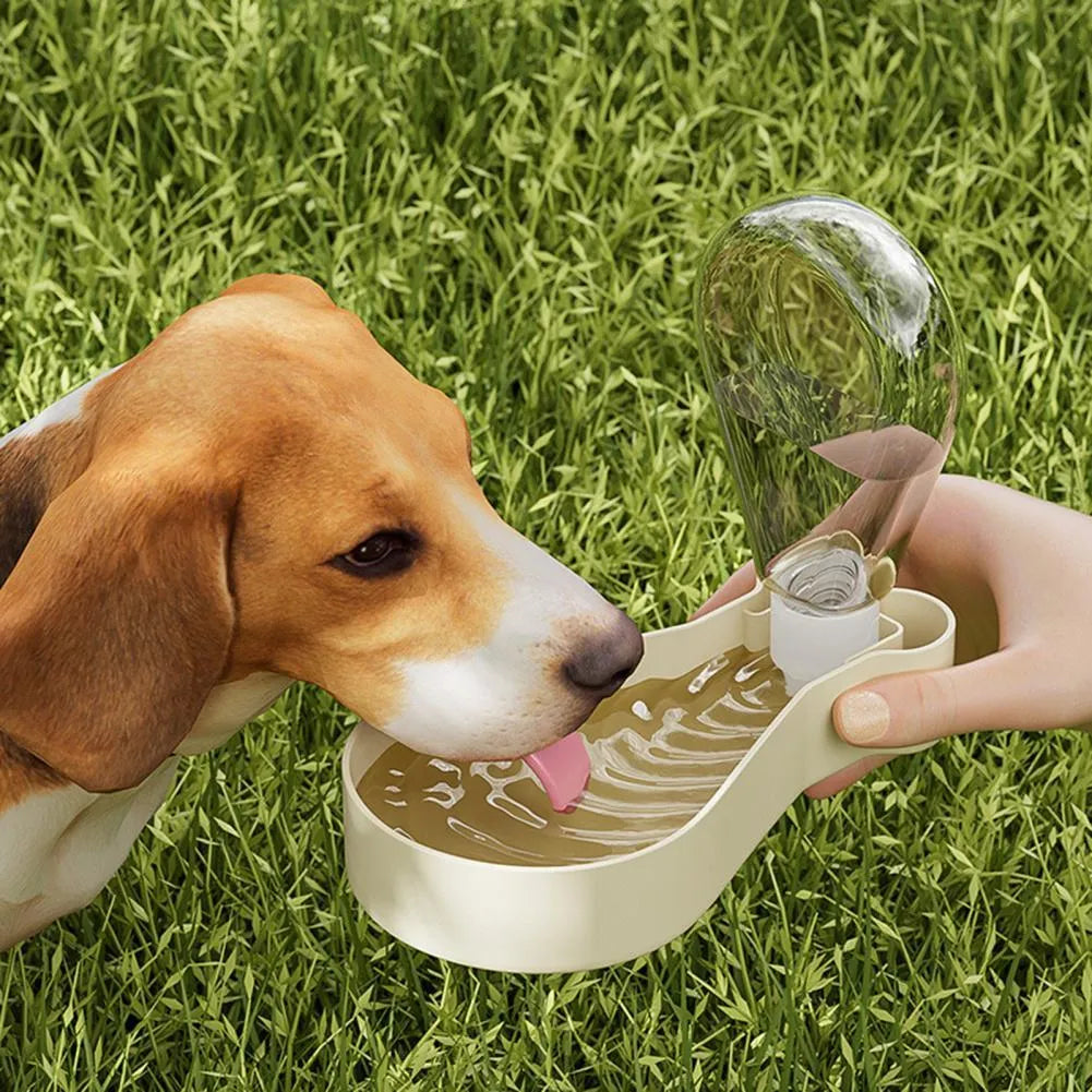 Orange and white portable pet water feeder with water bottle and food container compartments