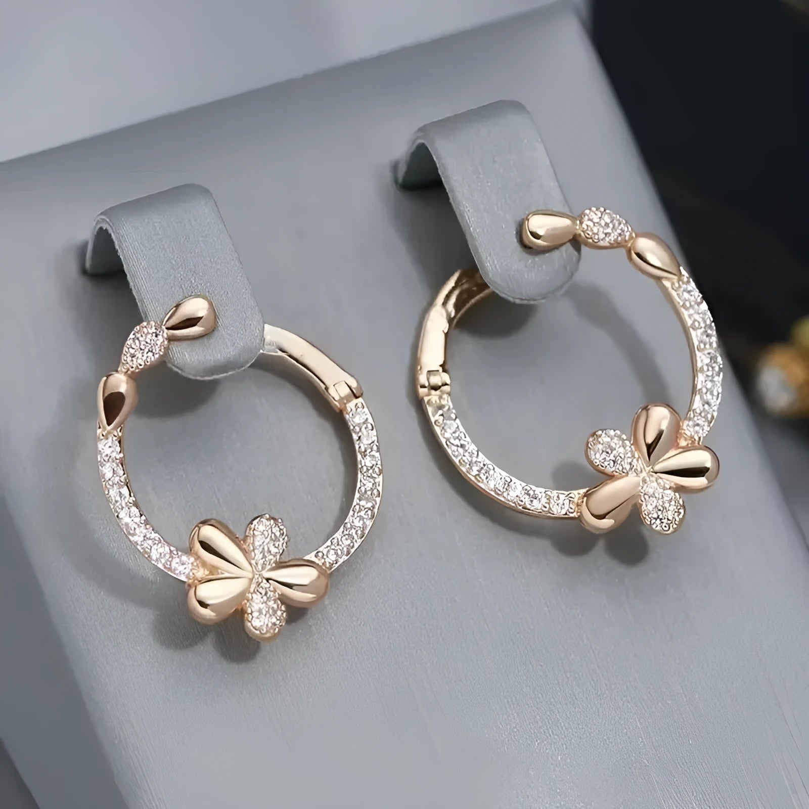 A pair of geometric round ring earrings for women in an electroplated copper finish.