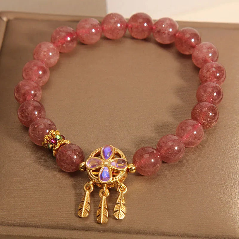 Women's strawberry quartz bracelet with four-leaf clover dream catcher and ball charm pendant