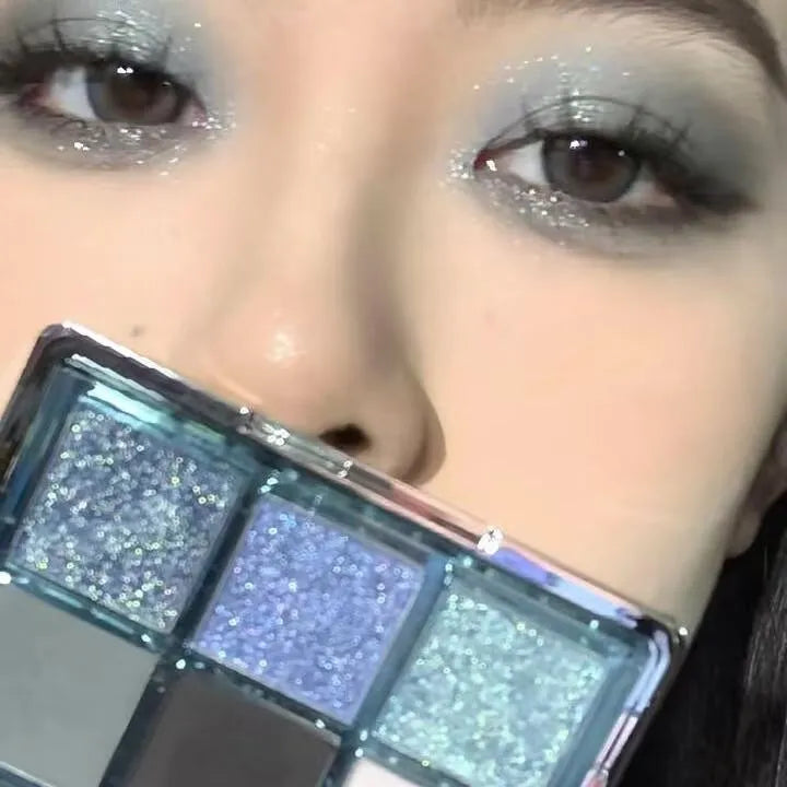 MUGELEEN nine-colour eye shadow palette showing low saturation blue smoked shades with matte and shimmer finishes