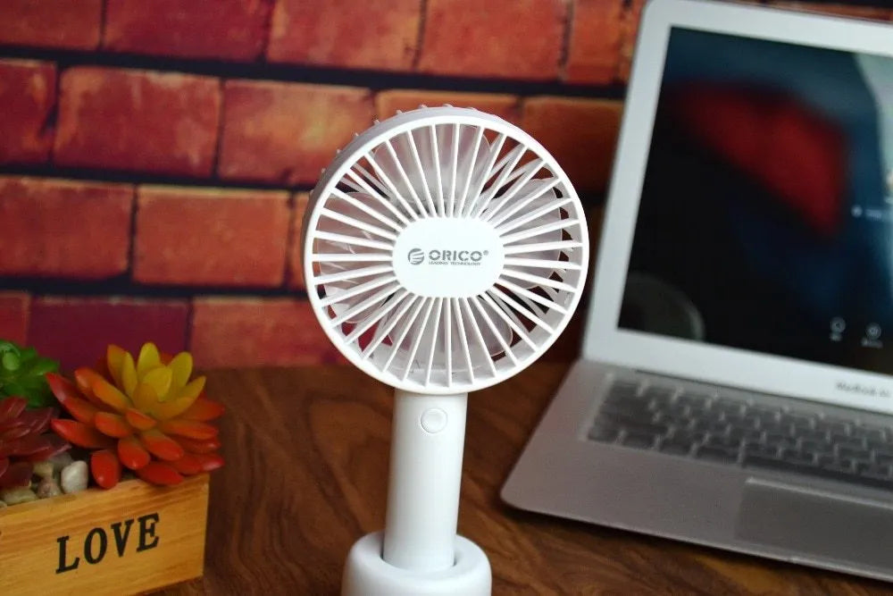White ORICO FH1 USB rechargeable portable handheld and desktop fan with fine-line detailing.