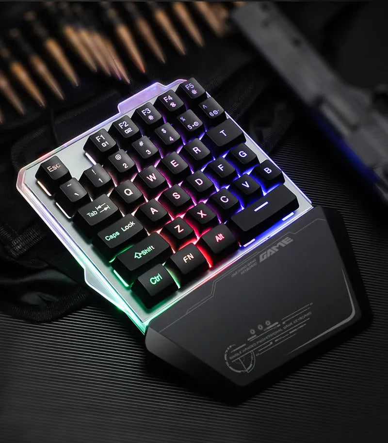 G40 black one-handed mechanical keyboard with RGB backlit keys on a desk.
