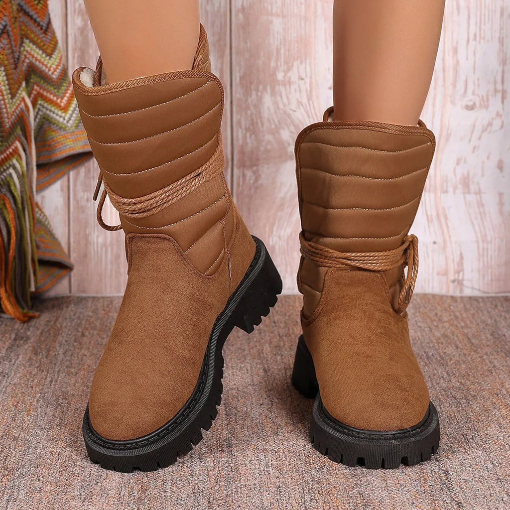 Women's black chunky heel snow boots with suede upper and lace-up design