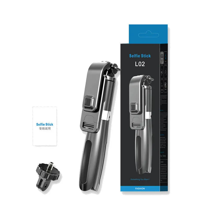 Black extendable Bluetooth selfie stick tripod with wireless remote next to a smartphone