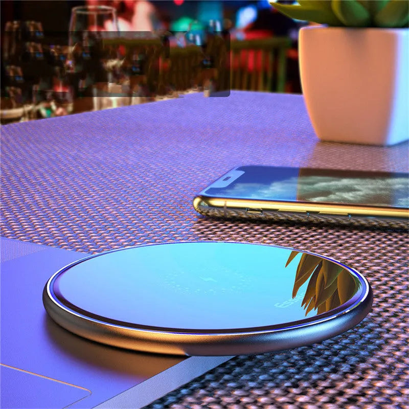 15W Qi wireless charging pad with aluminium surface showing blue LED charging indicator
