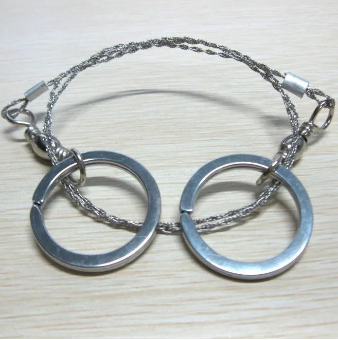 Stainless steel survival wire saw with thumb rings for outdoor cutting