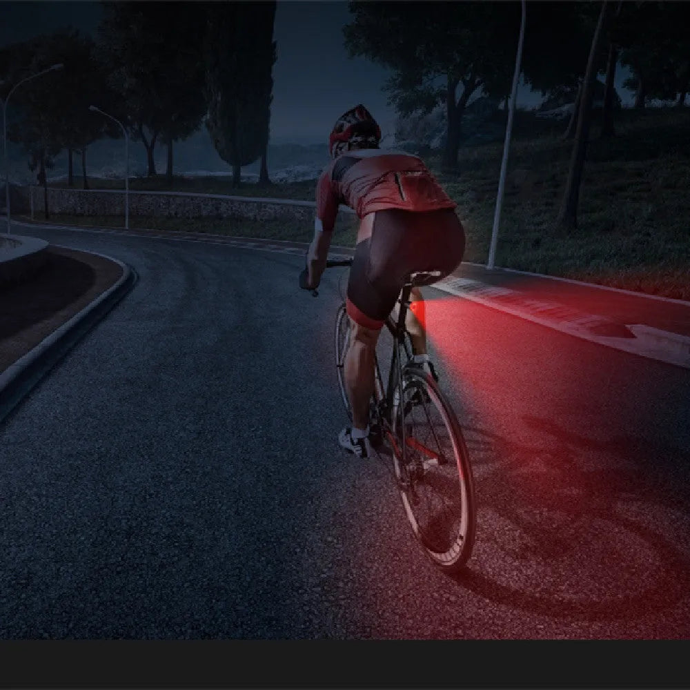 Black aluminium smart brake sensing USB rechargeable bicycle taillight showing compact size.