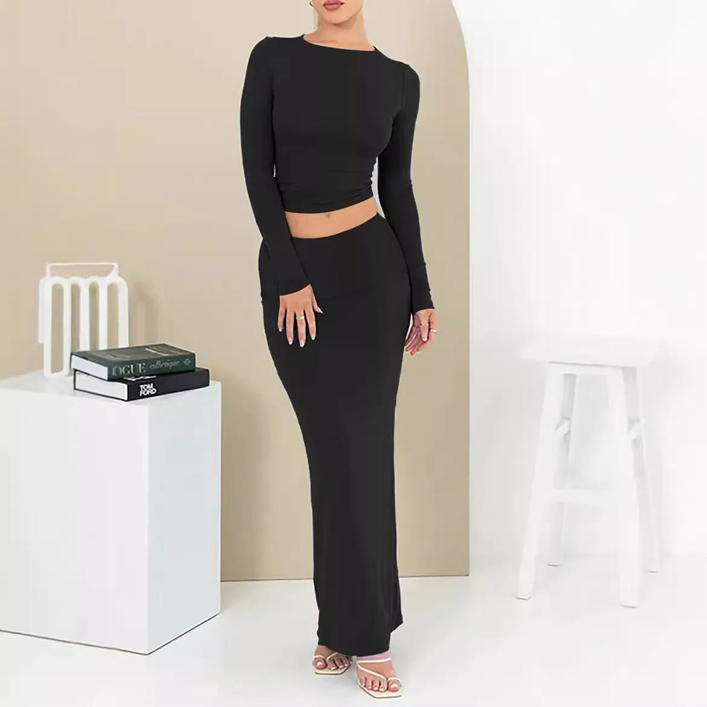 Women's sweet style two-piece suit with a cropped top and long skirt in polyester fabric.