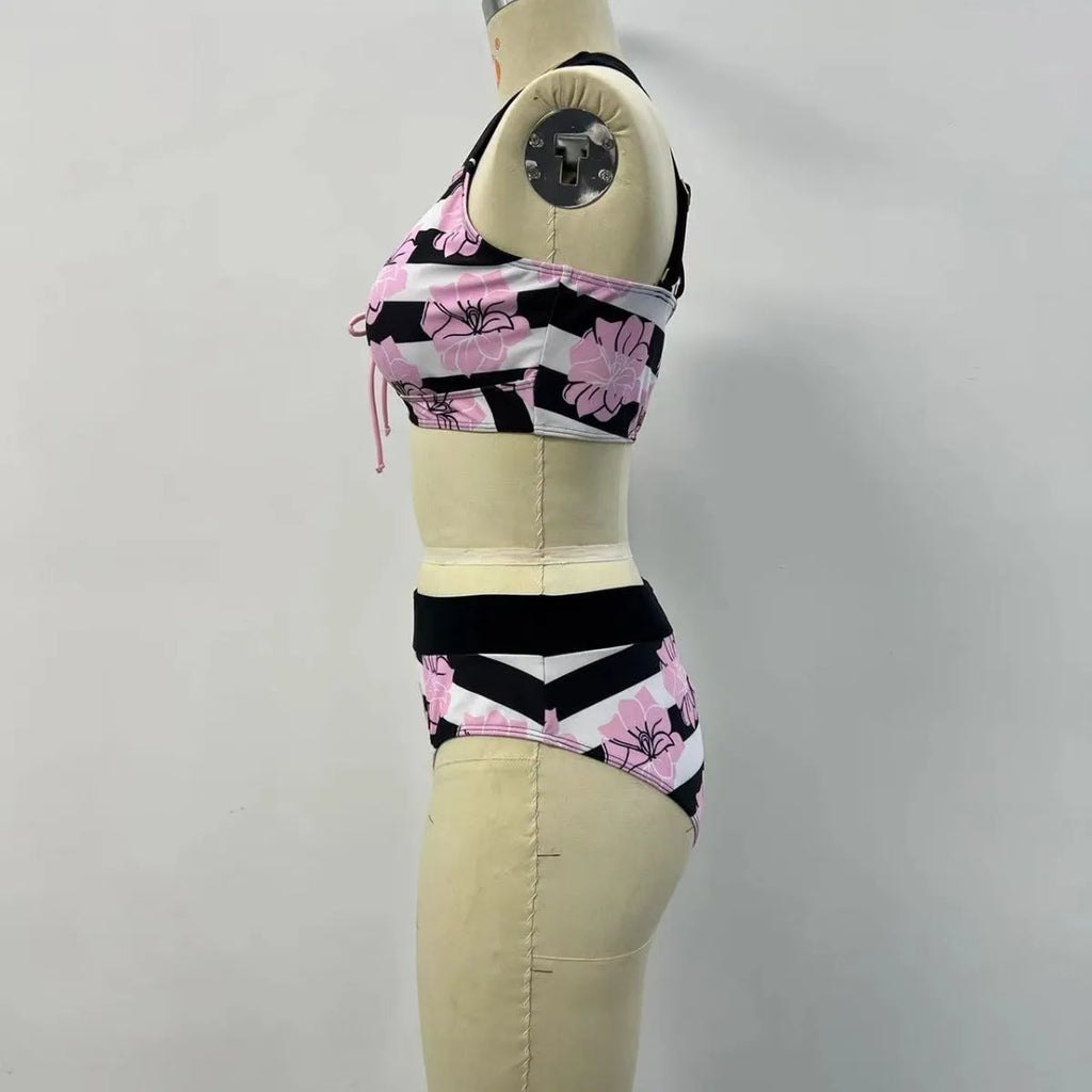 Black women's two-piece bikini swimsuit with printed belly cover design.