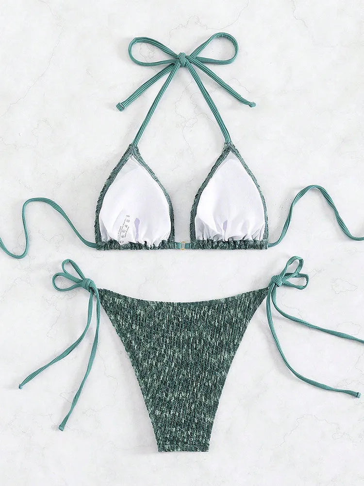 Women's green halter strap backless swimsuit with three-point design and matching shorts