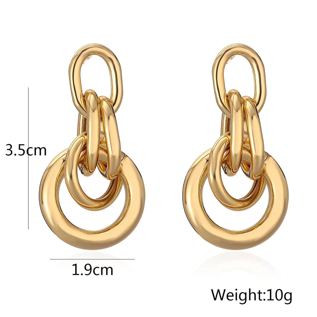 Geometric copper earrings for women in gold with irregular high-profile shape