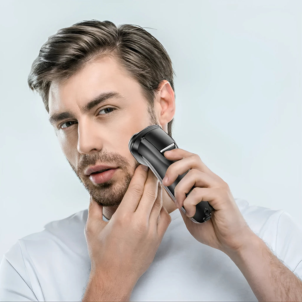 Electric shaver with three rotating heads and pop-up sideburn trimmer on black background