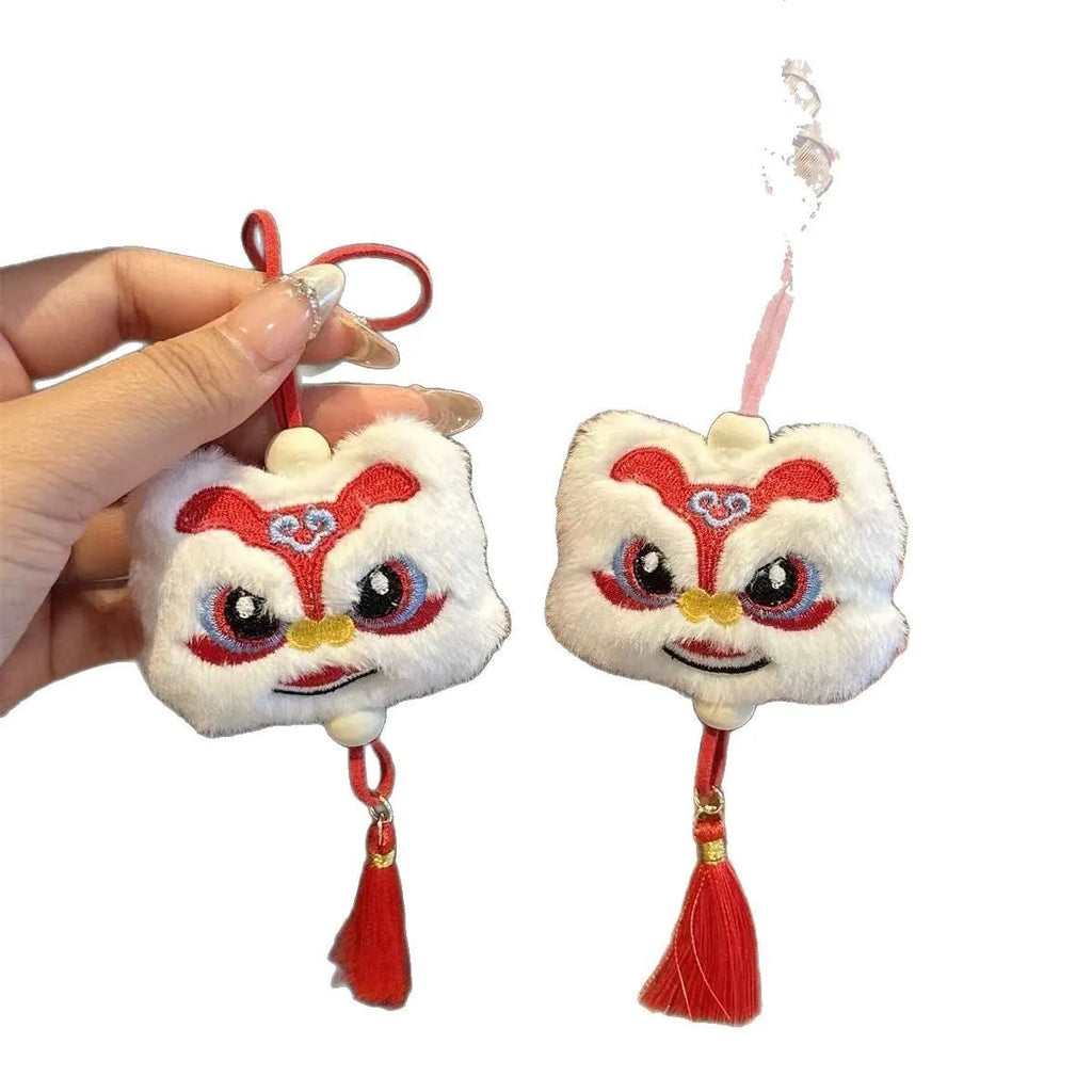 Blue Chinese style plush lion keychain ornament with tassels and star stone detail