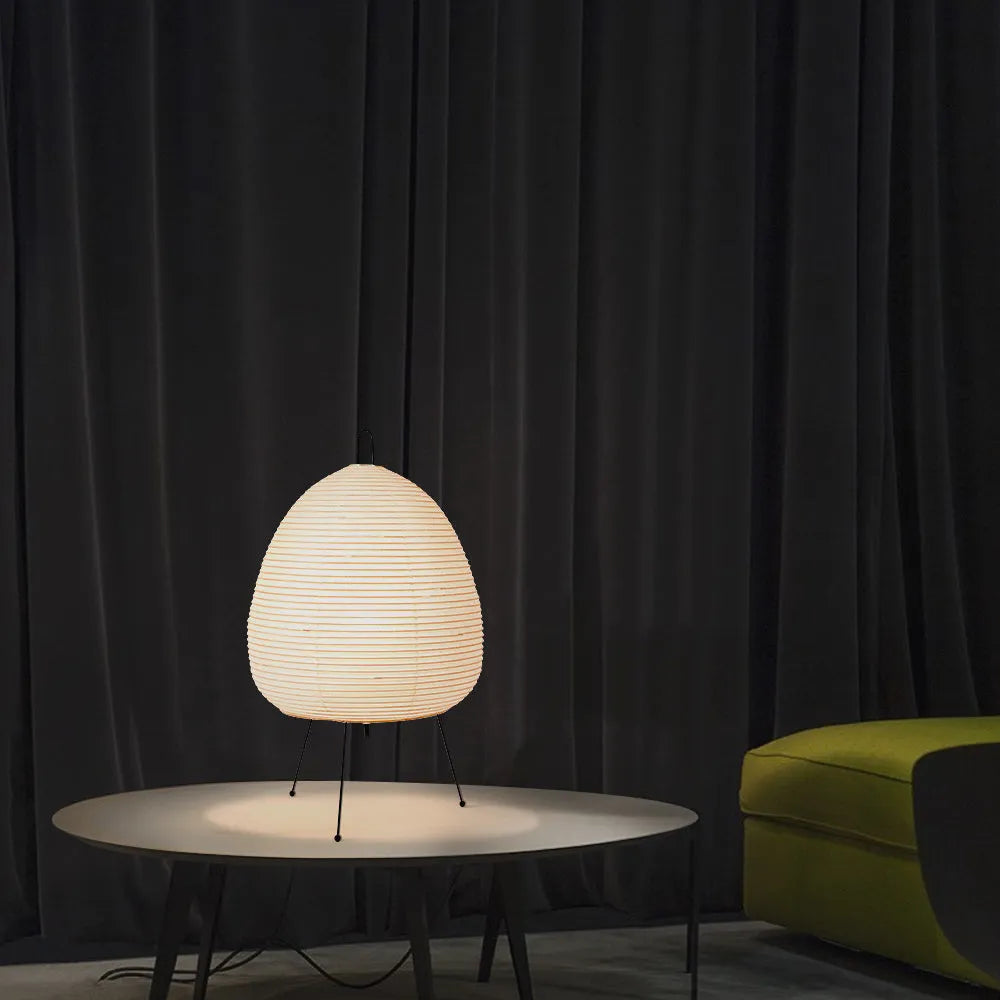 Japanese style rice paper table lamp with handmade shade and aluminium base on wooden surface