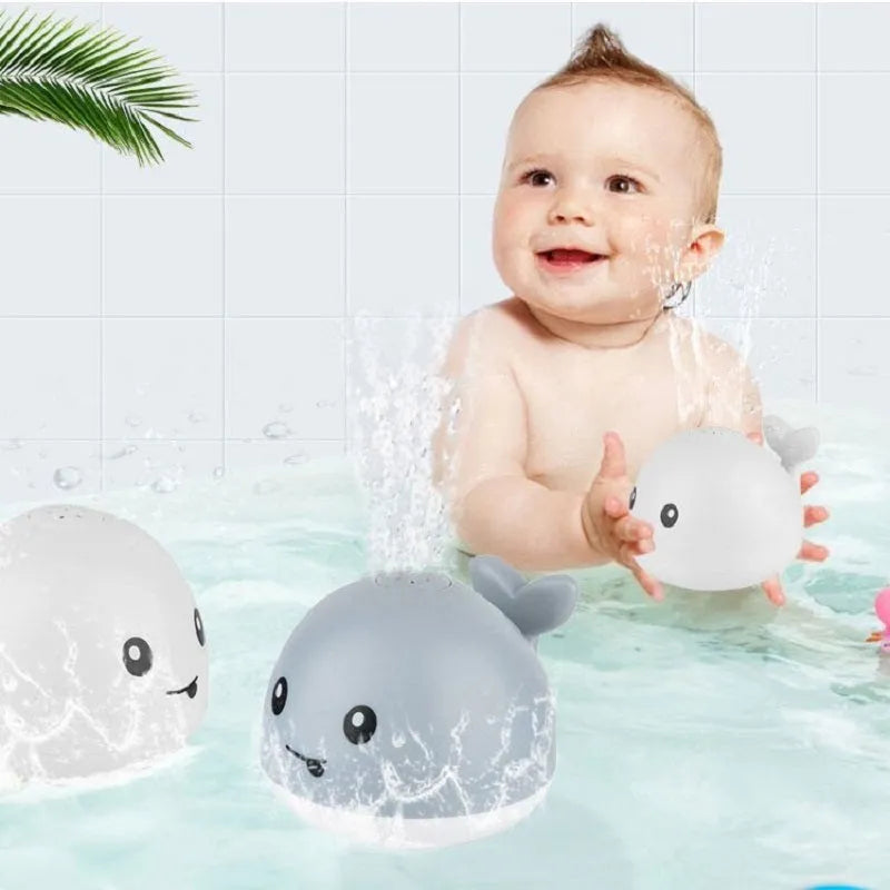 Electric induction whale bath toy with water spray and LED lights for baby bath time