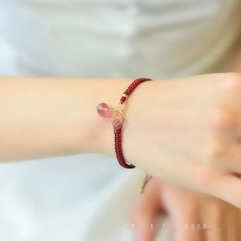 Natural strawberry quartz cherry bracelet for women on adjustable elastic cord, showing fruit-shaped crystal design.