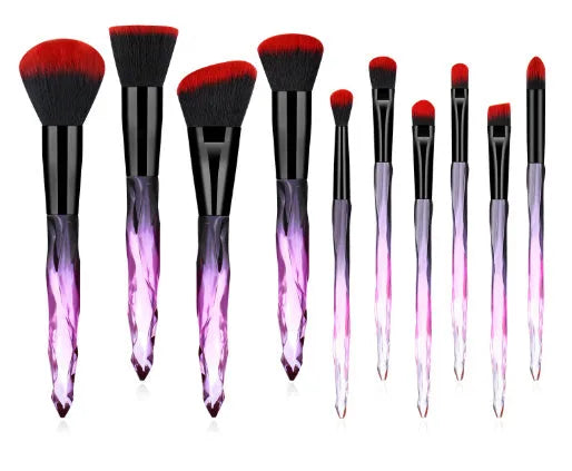 Set of 10 clear crystal handle foundation brushes with diamond shank design and synthetic bristles.