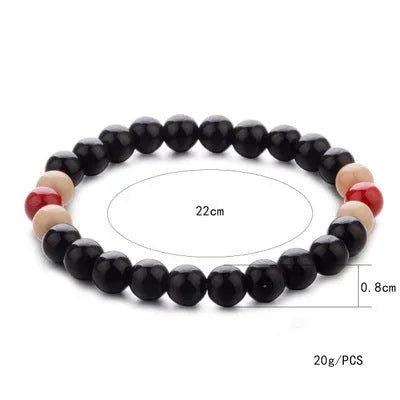 Natural stone bead bracelet with ethnic styling and lava stone components for essential oils