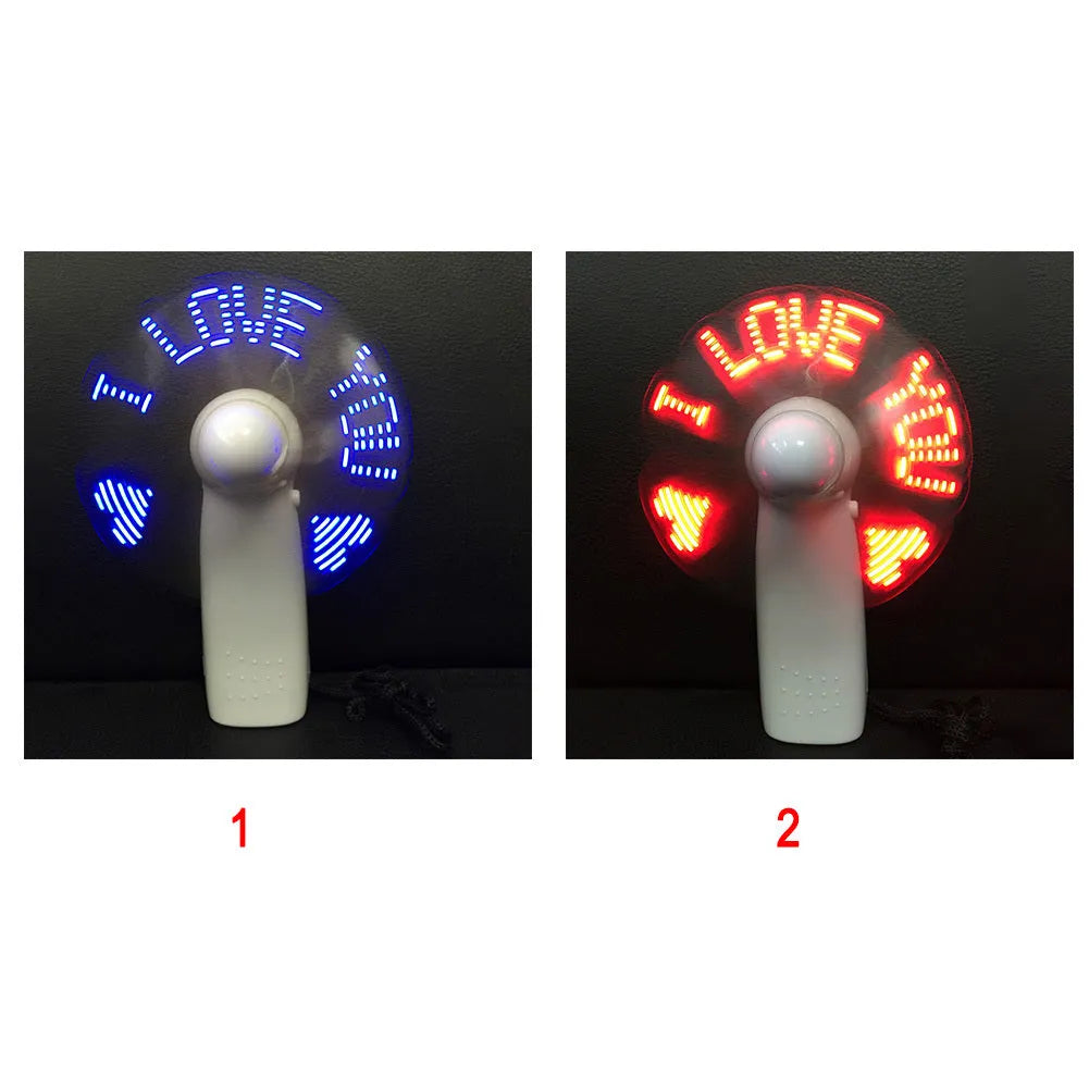 White handheld mini fan with LED love pattern lights flashing in blue and red colours