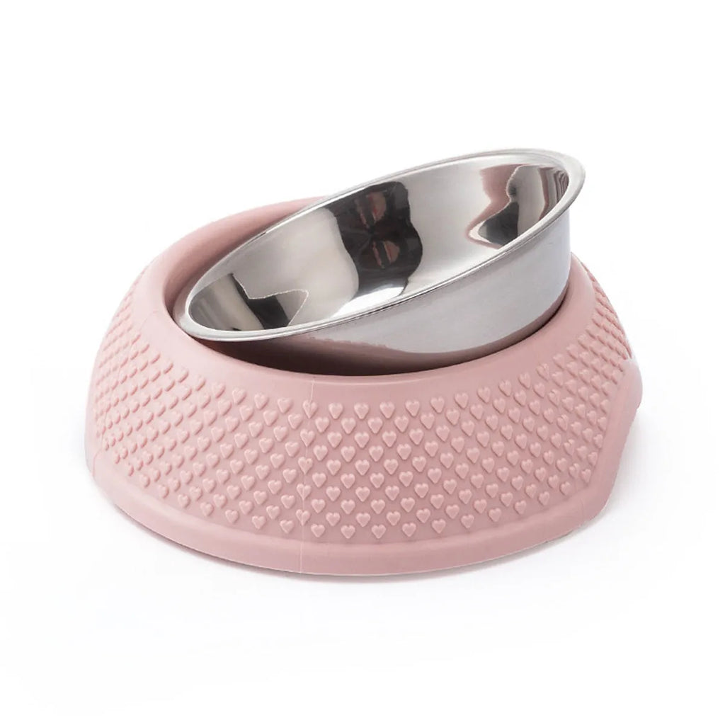 Blue stainless steel pet bowl with non-slip base for cats and dogs on a kitchen floor.