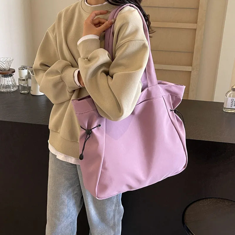 Folding Oxford cloth tote bag in multiple colour options showing compact storage design
