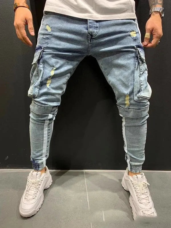 Men's denim knee-cut zipper trousers in black, front view, showing zipper placket and relaxed fit