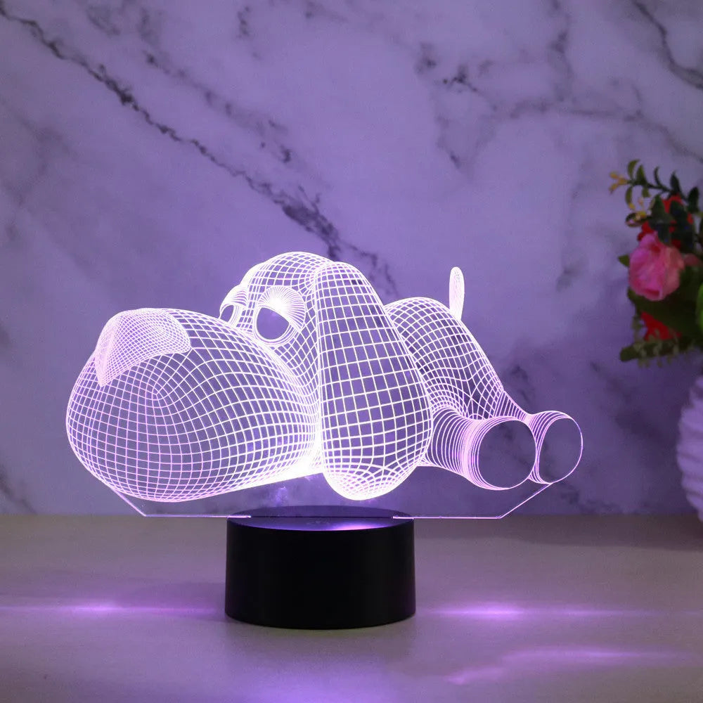 Doggo Desktop Lamp showing 3D dog illusion glowing in blue light on a desk